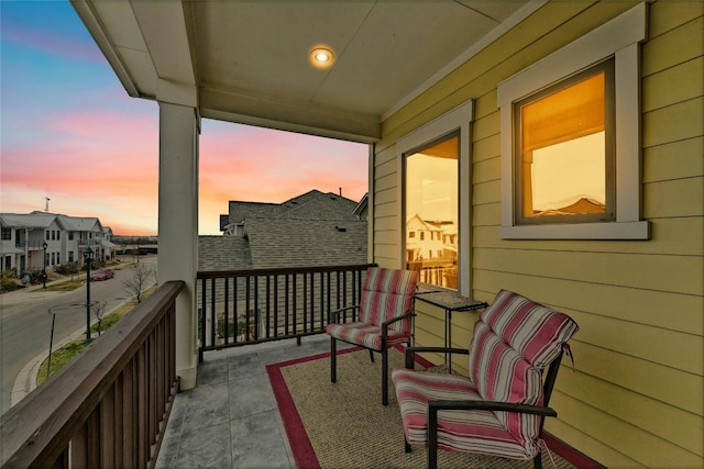 view of balcony at dusk