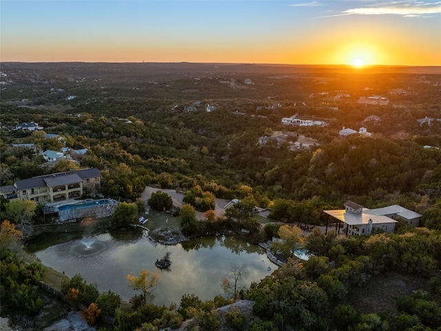 aerial view at dusk with a water view