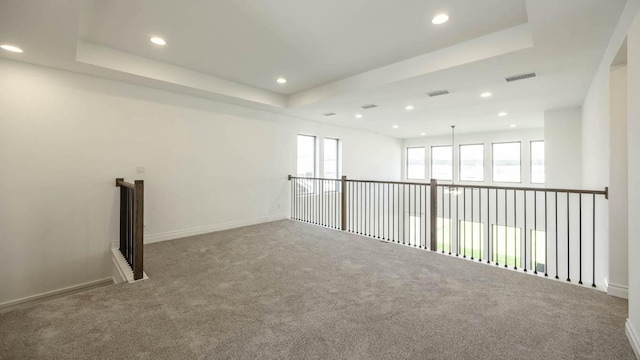 220 La Venta Loop, Liberty Hill, TX 78642 - empty room with carpet flooring, recessed lighting, and a tray ceiling
