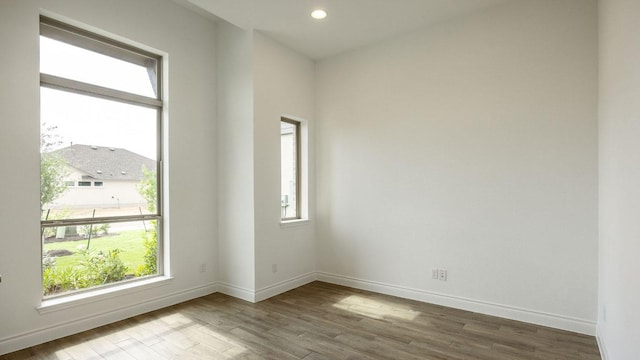 220 La Venta Loop, Liberty Hill, TX 78642 - empty room featuring wood finished floors and recessed lighting