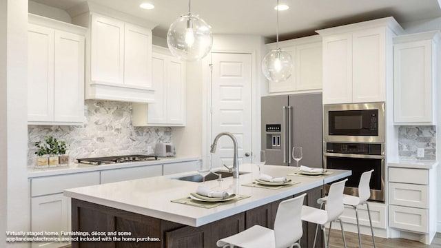 220 La Venta Loop, Liberty Hill, TX 78642 - kitchen with stainless steel appliances, tasteful backsplash, recessed lighting, and white cabinets