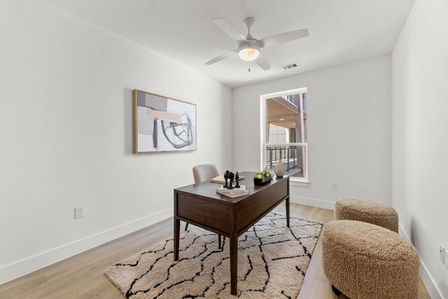 1701 Simond Ave Unit 546, Austin, TX 78723 - office with light wood finished floors, baseboards, and a ceiling fan
