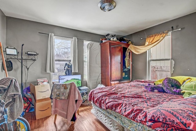 bedroom with hardwood / wood-style floors