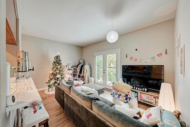 living room featuring light hardwood / wood-style flooring and french doors