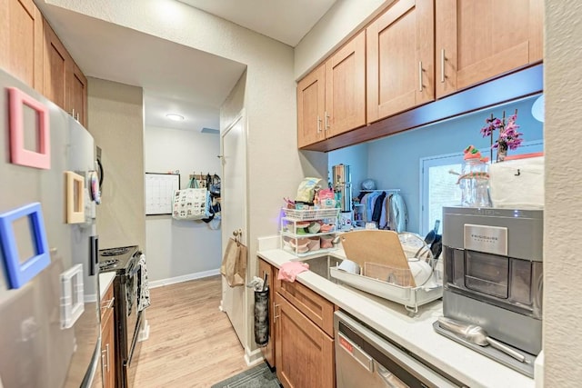 kitchen with light wood-type flooring and black / electric stove