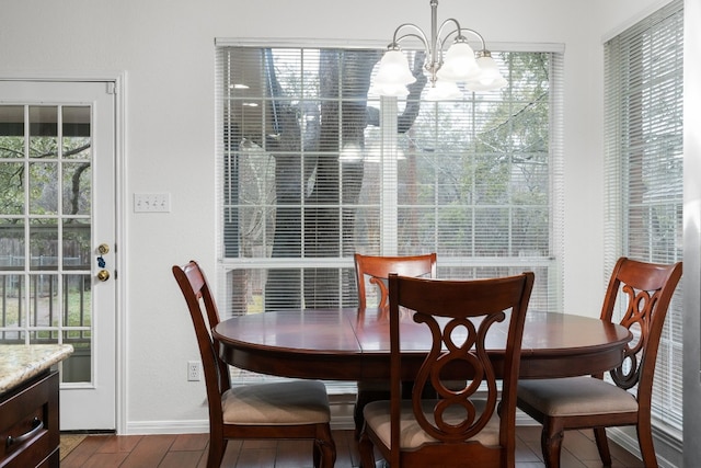 dining room featuring an inviting chandelier and wood-type flooring