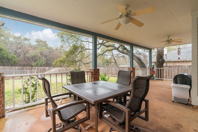 sunroom / solarium with ceiling fan