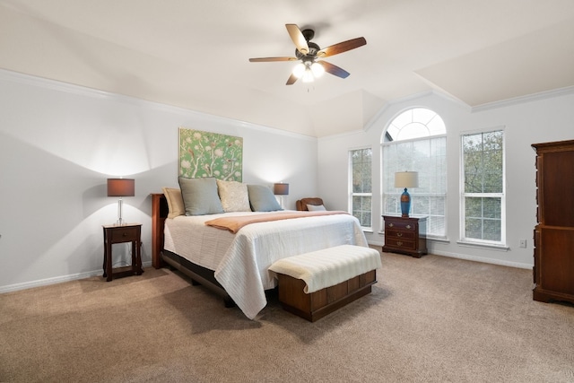 carpeted bedroom with crown molding, ceiling fan, and lofted ceiling