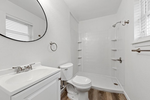 803 N 19th St, Copperas Cove, TX 76522 - bathroom with wood finished floors, vanity, toilet, and a shower