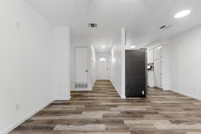 803 N 19th St, Copperas Cove, TX 76522 - hall with wood finished floors, baseboards, and recessed lighting