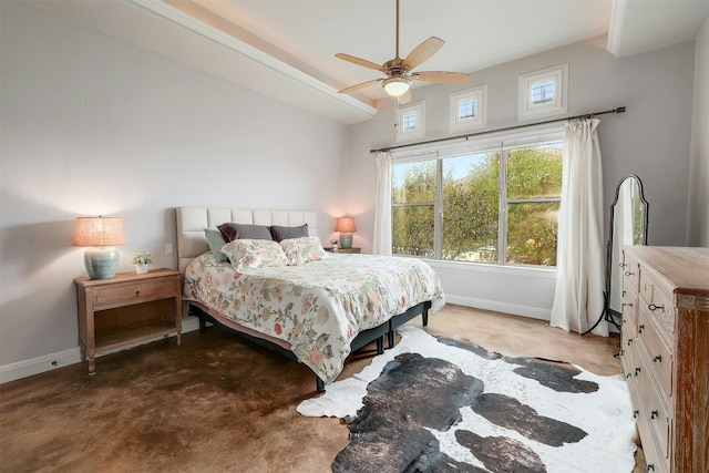 carpeted bedroom with a ceiling fan and baseboards