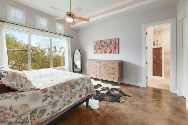 bedroom featuring a ceiling fan, finished concrete flooring, and baseboards