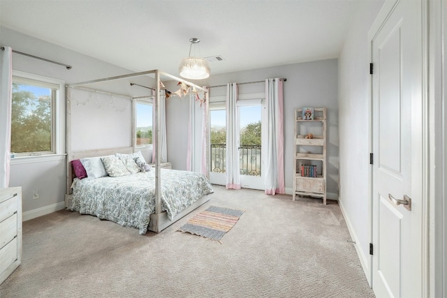 bedroom with an inviting chandelier, baseboards, visible vents, and light colored carpet