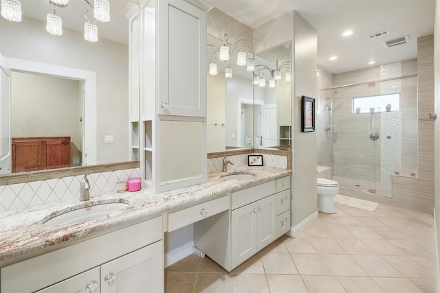 full bathroom with tile patterned flooring, a sink, and visible vents