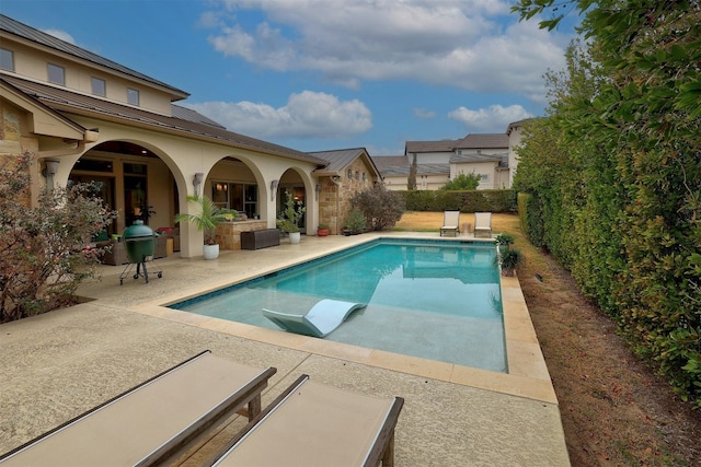 view of pool featuring a fenced in pool, a fenced backyard, and a patio