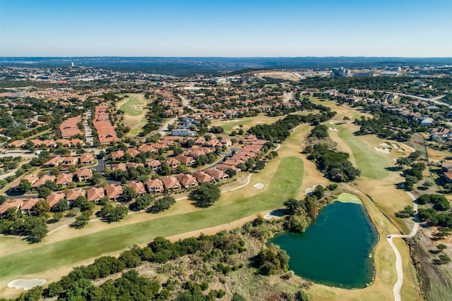 birds eye view of property featuring a water view and view of golf course