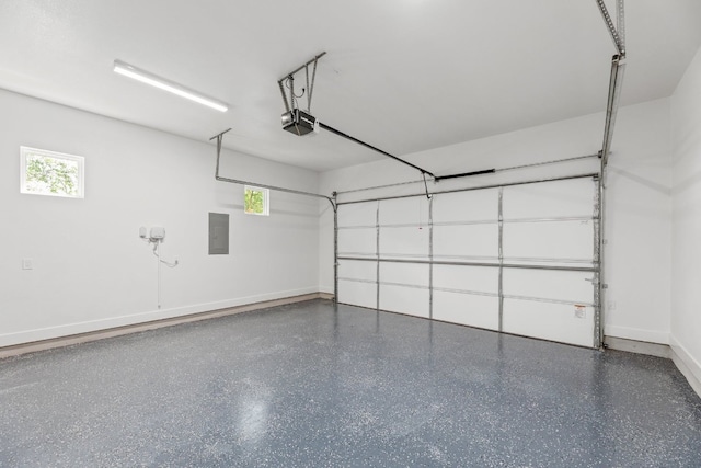 garage featuring a garage door opener and electric panel