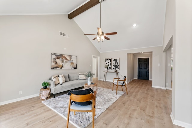 living room featuring ceiling fan, high vaulted ceiling, beamed ceiling, and light wood-type flooring