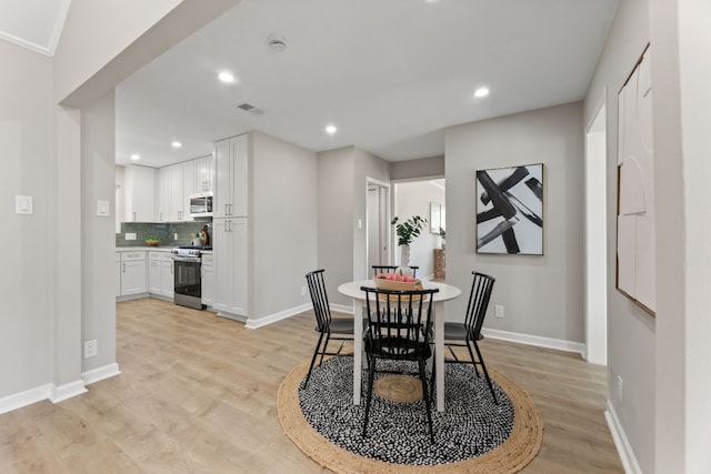 dining room featuring light wood-type flooring