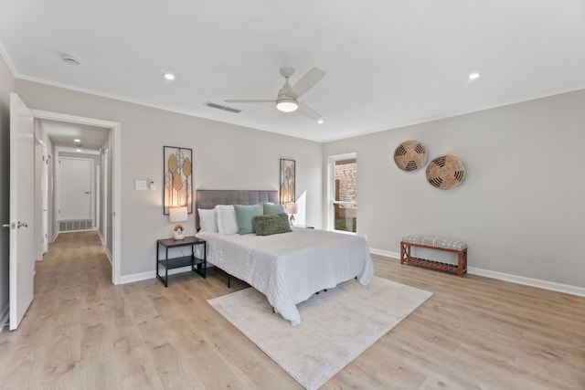 bedroom featuring ornamental molding, ceiling fan, and light wood-type flooring