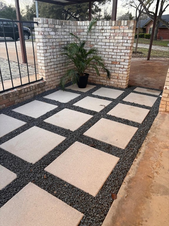 view of patio featuring fence