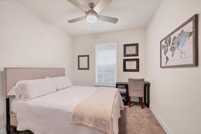 bedroom featuring ceiling fan and light carpet