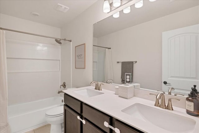 full bathroom with shower / bath combination with curtain, vanity, toilet, and tile patterned flooring