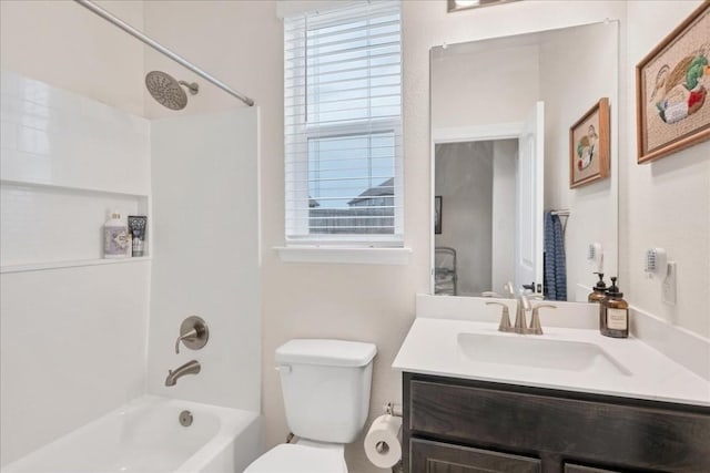 full bathroom featuring vanity, toilet, and washtub / shower combination