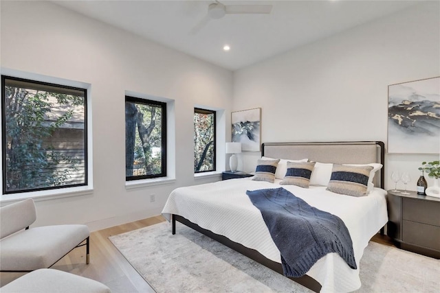 bedroom featuring ceiling fan and light hardwood / wood-style flooring