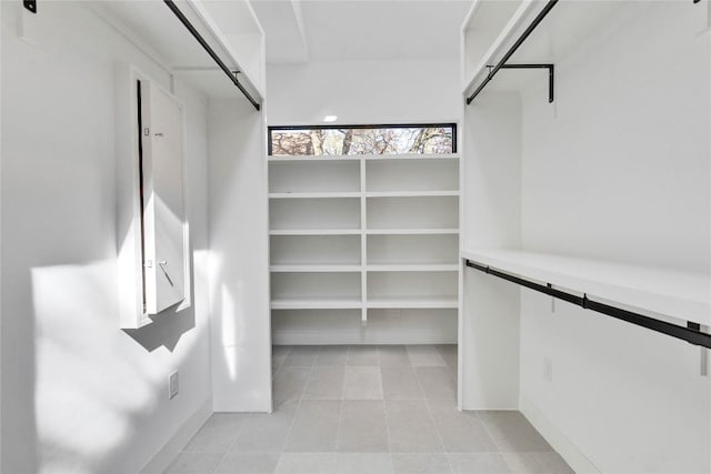 spacious closet with light tile patterned flooring