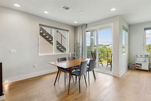 dining room with light hardwood / wood-style flooring