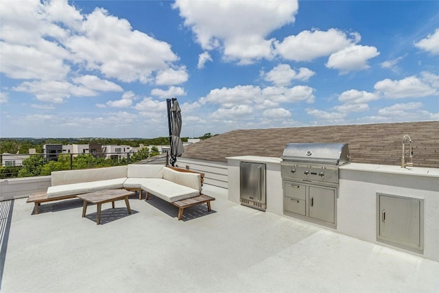 view of patio with an outdoor kitchen, outdoor lounge area, sink, and grilling area