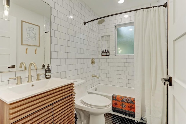 full bathroom with toilet, tasteful backsplash, tile walls, vanity, and shower / bath combination with curtain