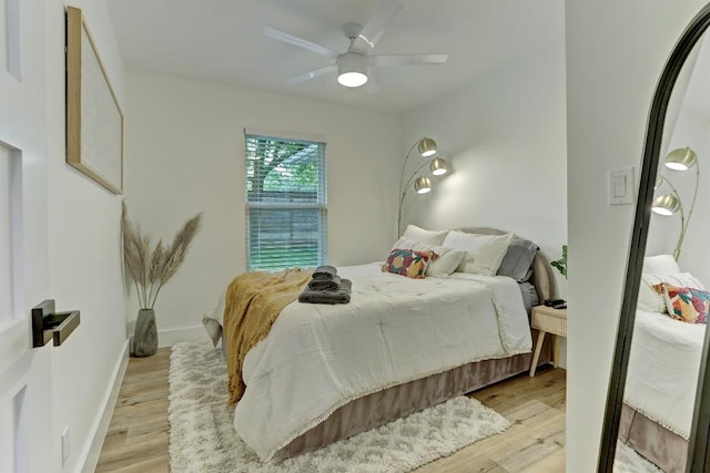 bedroom with ceiling fan and light wood-type flooring