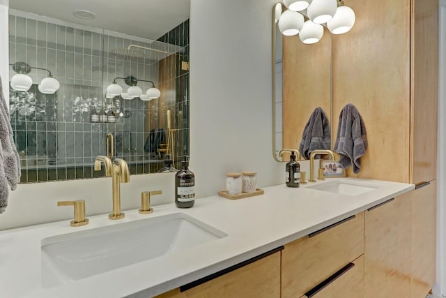 bathroom featuring walk in shower and vanity