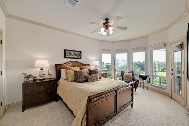 bedroom with multiple windows, access to outside, and ornamental molding