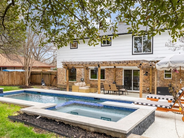 rear view of property featuring a pool with hot tub, an outdoor living space, a pergola, and a patio