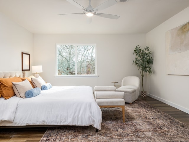 bedroom with dark wood-type flooring and ceiling fan