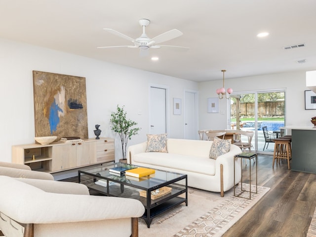 living room with hardwood / wood-style floors and ceiling fan