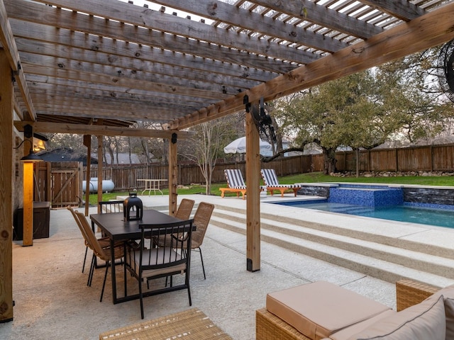 view of patio / terrace with a pool with hot tub and a pergola