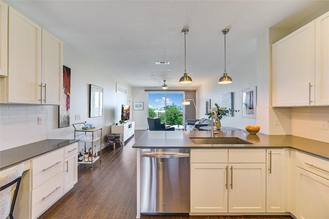 2800 Treble Ln Unit 831, Austin, TX 78704 - kitchen with dishwasher, a peninsula, open floor plan, and decorative backsplash