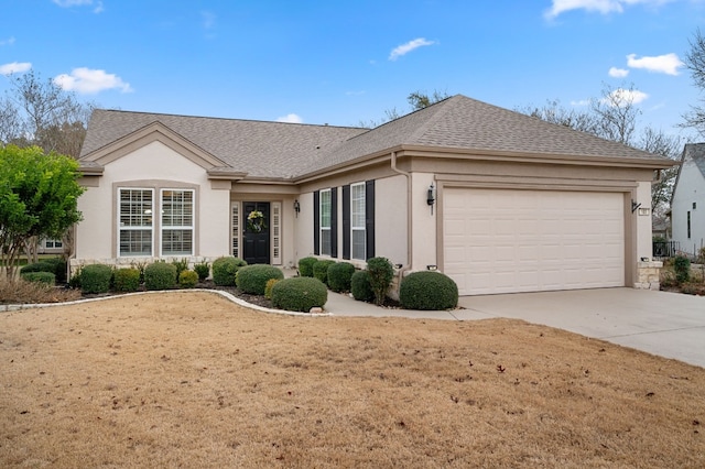 single story home featuring a garage and a front yard