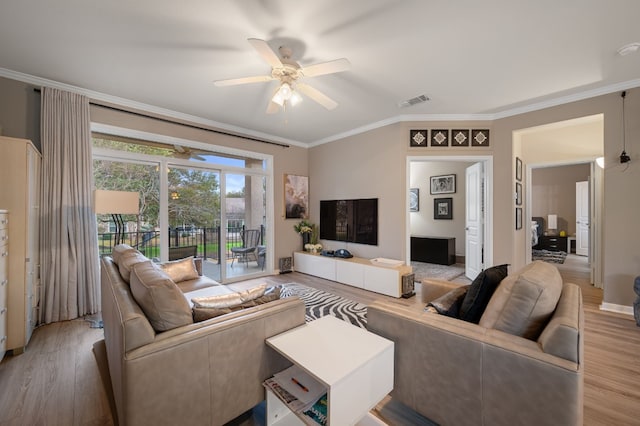 living room with crown molding, wood-type flooring, and ceiling fan