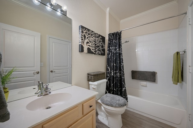 full bathroom featuring shower / tub combo with curtain, hardwood / wood-style flooring, vanity, ornamental molding, and toilet