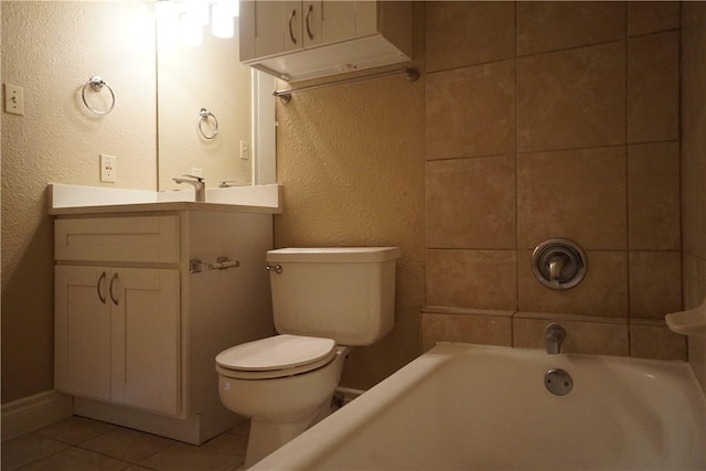 bathroom featuring tile patterned flooring, vanity, and toilet