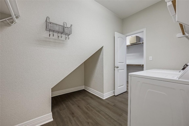 2104 Ringstaff Rd, Leander, TX 78641 - laundry room featuring washing machine and clothes dryer, dark wood finished floors, and baseboards