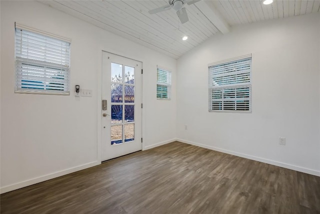 empty room with dark hardwood / wood-style flooring, lofted ceiling with beams, wooden ceiling, and ceiling fan