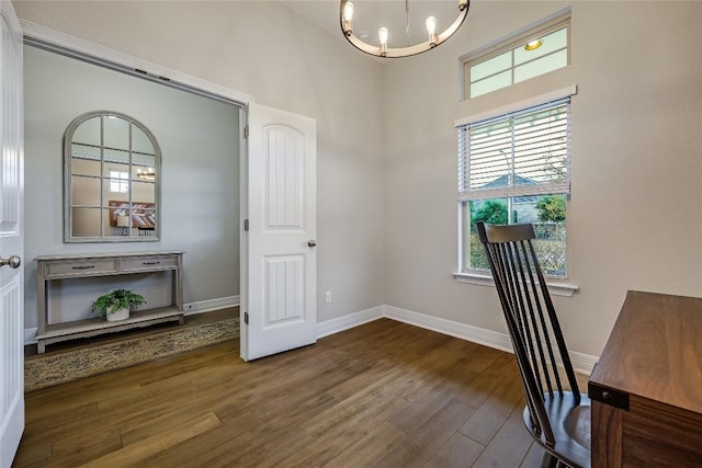 2104 Ringstaff Rd, Leander, TX 78641 - unfurnished office with a chandelier, a high ceiling, dark wood-style flooring, and baseboards