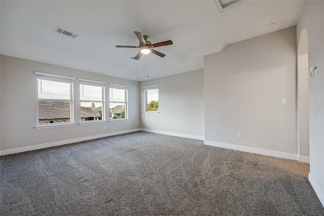 carpeted spare room featuring ceiling fan