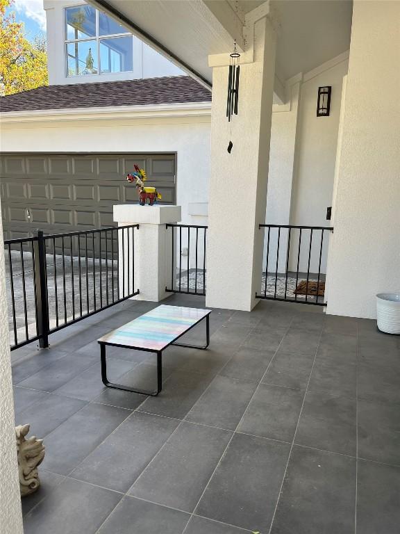 view of patio / terrace with a garage